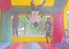 Jaceyon executes a smooth backflip in the bounce house. There were several activities including a corn hole tournament and a coloring table for the kids in the community. GAZETTE PHOTOS / ELIZABETH LANNING Celebrating the unity in community