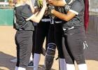 Members of the Lady Pirate softball team greet each other during player introductions earlier this season. GAZETTE PHOTOS / MICHAEL S. MCCRACKEN