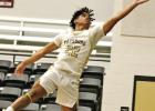 Pittsburg’s Toribio Willis (22) gets some serious hang time while attempting to save a ball from going out of bounds against Mount Vernon last week.